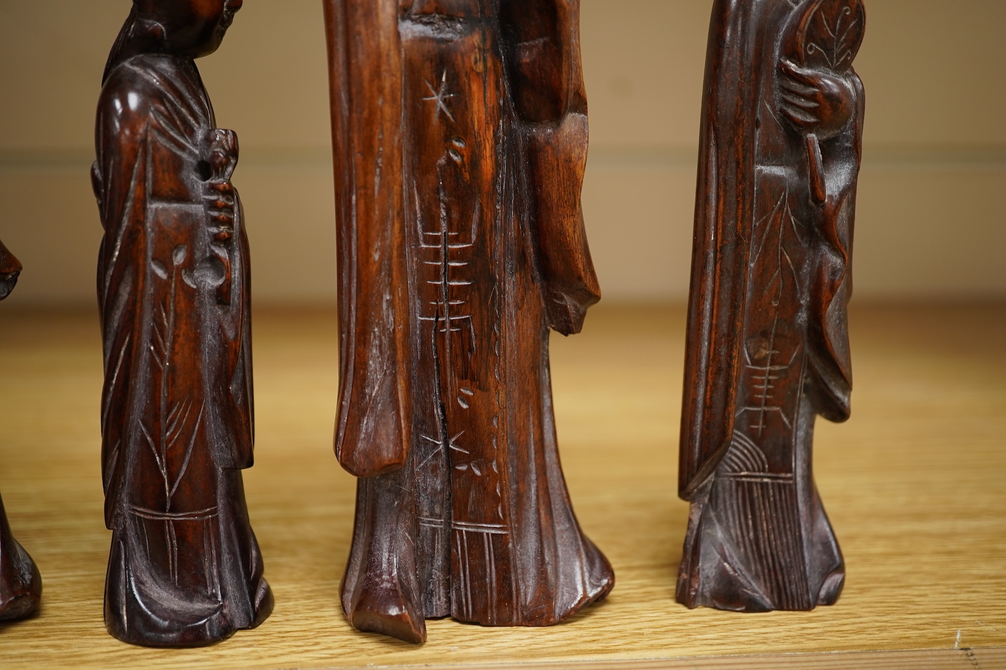 Six mid 20th century Chinese carved wood figures holding lotus and a Cultural Revolution carving of turin girls (7) tallest 21cm